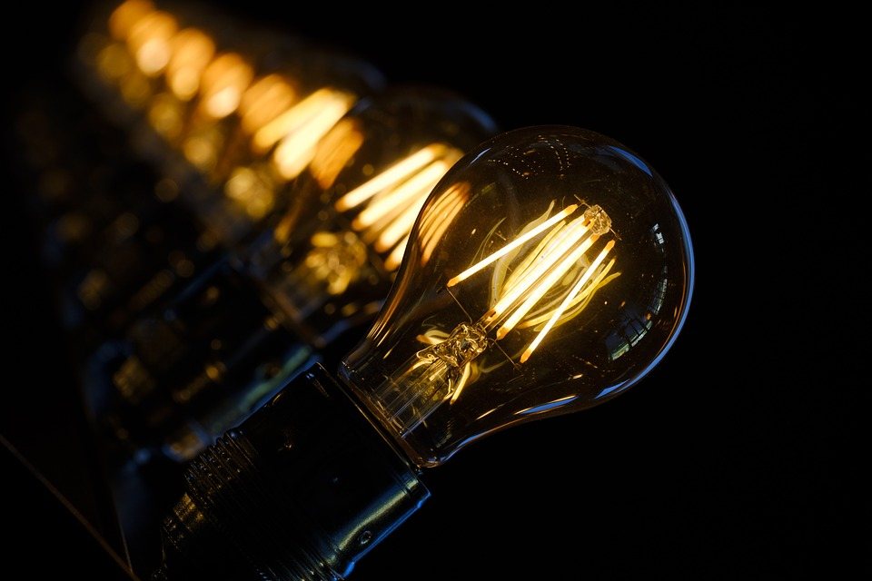 A glowing filament light bulb
